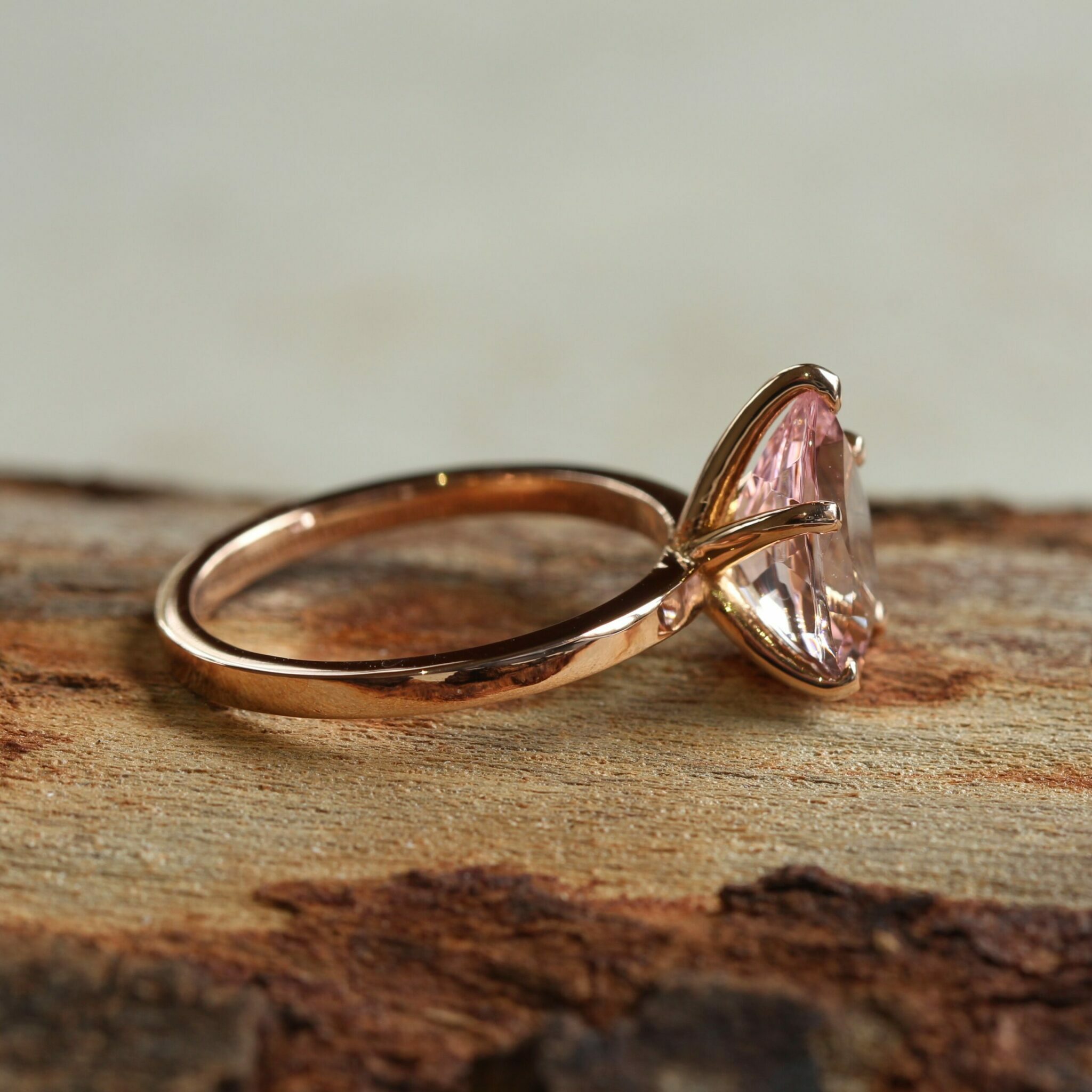 true-pink-morganite-solitaire-engagement-ring-12x8mm-pear-cut-six-prongs-14k-rose-gold-LS5951-side-wood