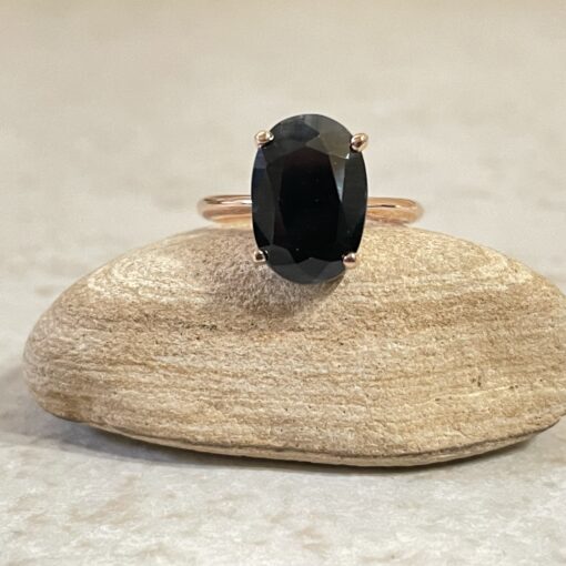 Custom black blue sapphire solitaire ring in 14k rose gold with moissanite band - Image 2