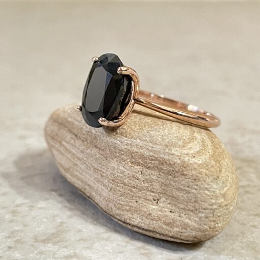 Custom black blue sapphire solitaire ring in 14k rose gold with moissanite band - Image 3